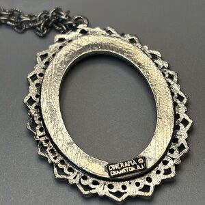 Antique silver tone signed “cinerama “pendant!